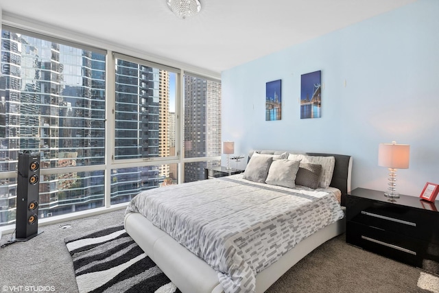 bedroom with expansive windows and carpet floors