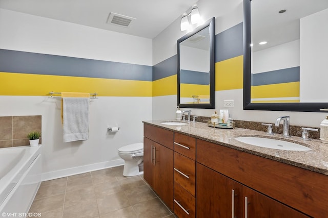 bathroom with a bathing tub, tile patterned flooring, vanity, and toilet