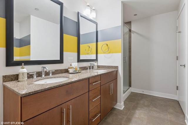 bathroom featuring vanity and a shower with shower door