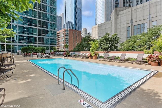 view of swimming pool featuring a patio area