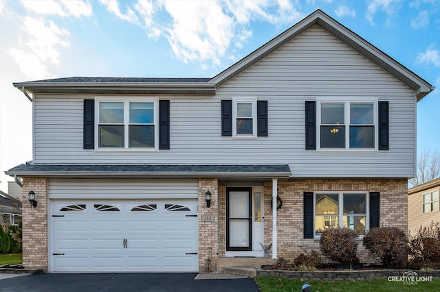 front of property with a garage