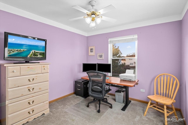 carpeted office featuring ceiling fan