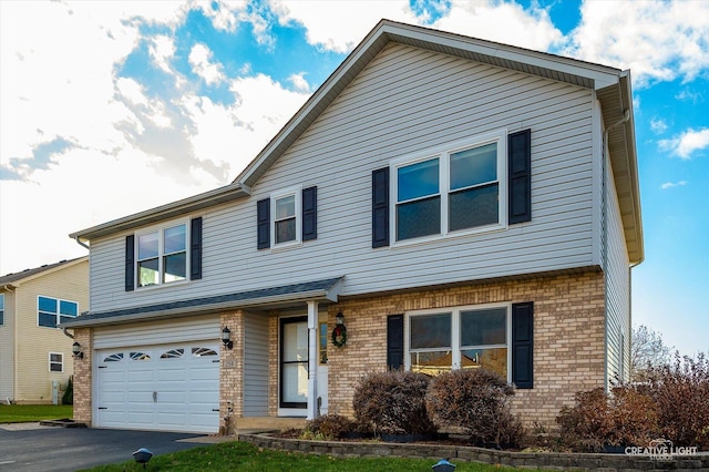 view of front of property with a garage