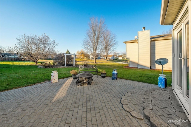 view of patio with an outdoor fire pit