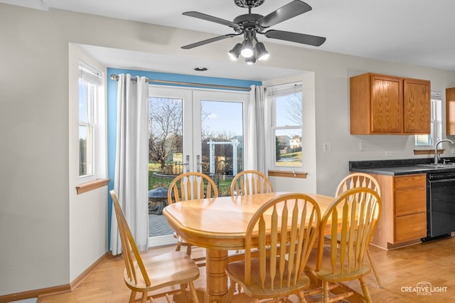 dining space with plenty of natural light, ceiling fan, and light hardwood / wood-style flooring