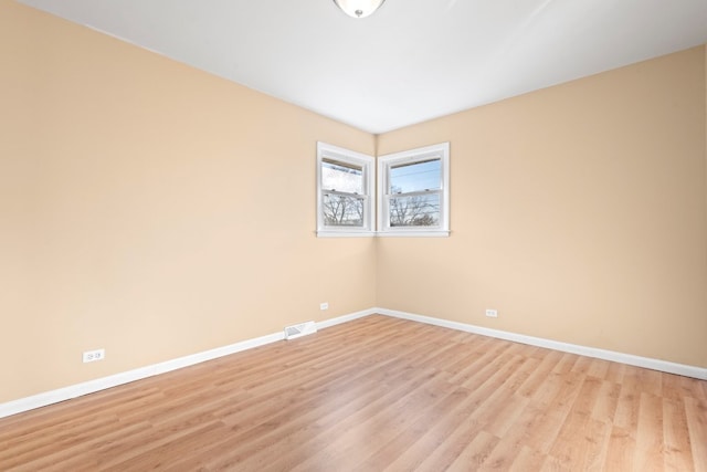 unfurnished bedroom with a closet and light hardwood / wood-style floors