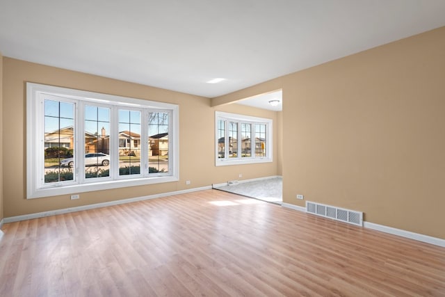 unfurnished room with light hardwood / wood-style floors