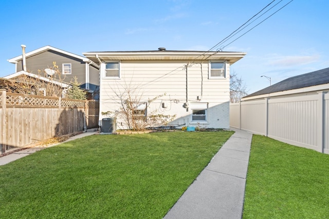 exterior space with central AC and a yard