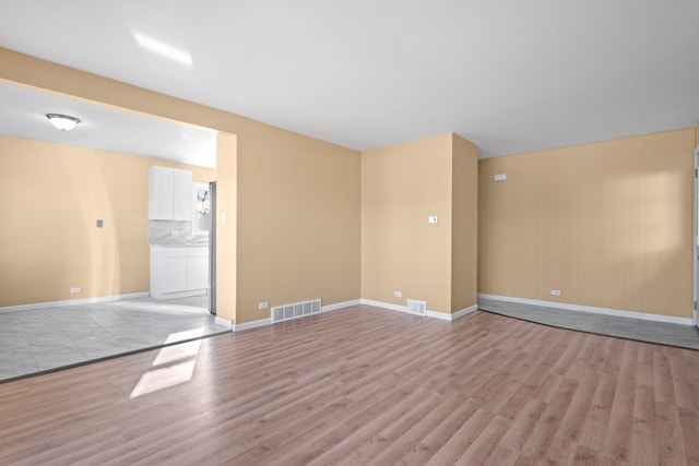 unfurnished room featuring light hardwood / wood-style floors