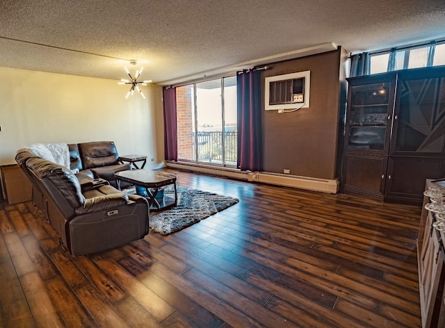 living room with a wall mounted AC, dark hardwood / wood-style flooring, a textured ceiling, and a notable chandelier