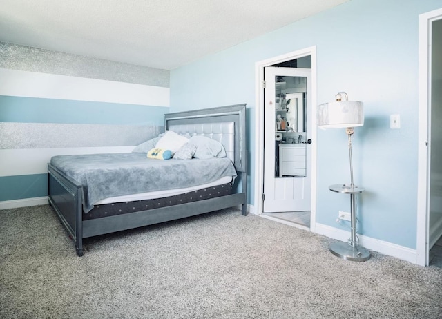 carpeted bedroom featuring a textured ceiling