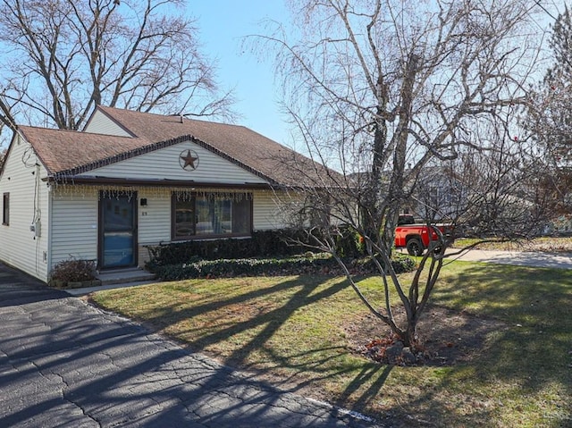 ranch-style house with a front lawn