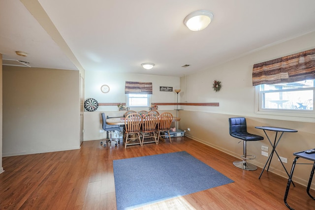 dining room with hardwood / wood-style flooring