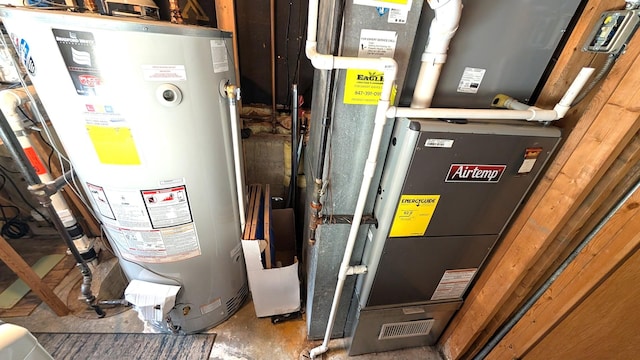 utility room with gas water heater and heating unit