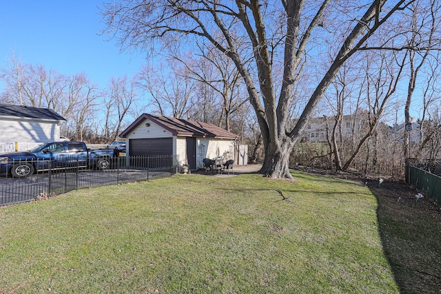 view of yard featuring an outbuilding and a garage