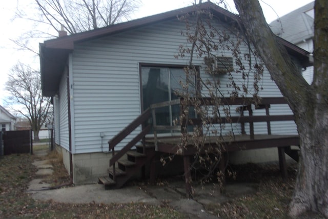 back of property with a wooden deck