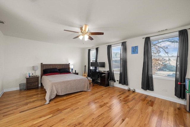 bedroom with ceiling fan and light hardwood / wood-style floors