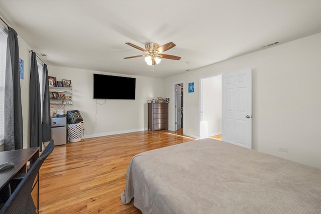 bedroom with light hardwood / wood-style floors and ceiling fan