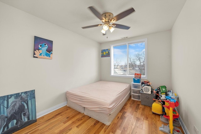 bedroom featuring ceiling fan and hardwood / wood-style flooring