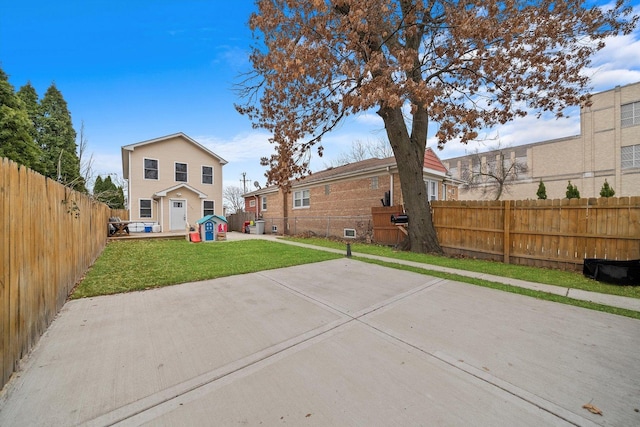 back of property featuring a yard and a patio area