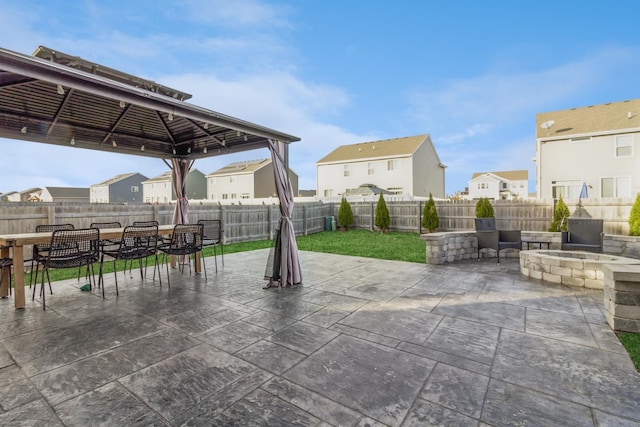 view of patio / terrace featuring a gazebo and an outdoor fire pit