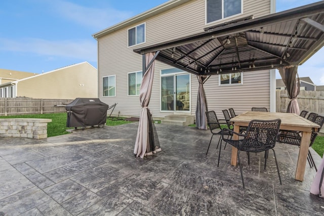 view of patio with a gazebo and a grill