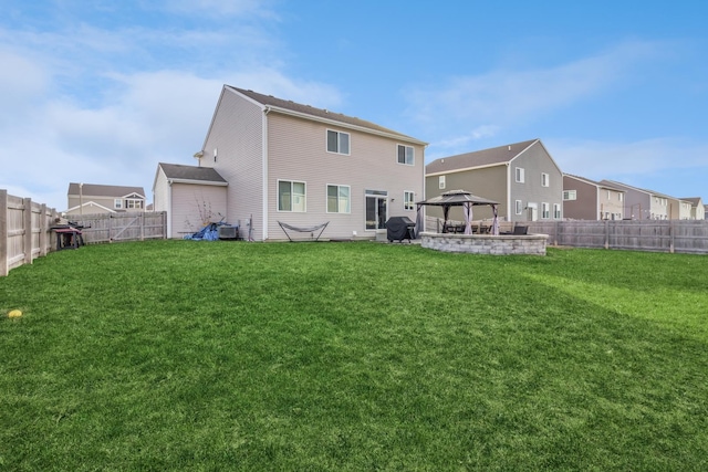 back of house featuring a gazebo, central AC unit, and a lawn