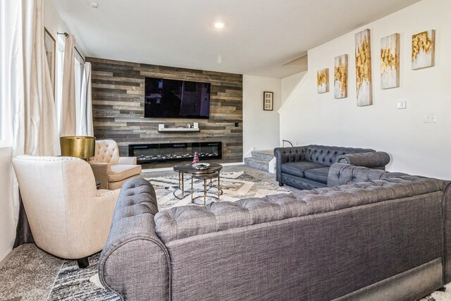 living room featuring a fireplace and carpet floors