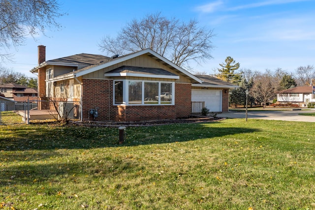 view of front of house with a garage and a front yard