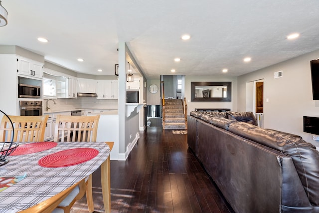 interior space featuring sink and dark wood-type flooring