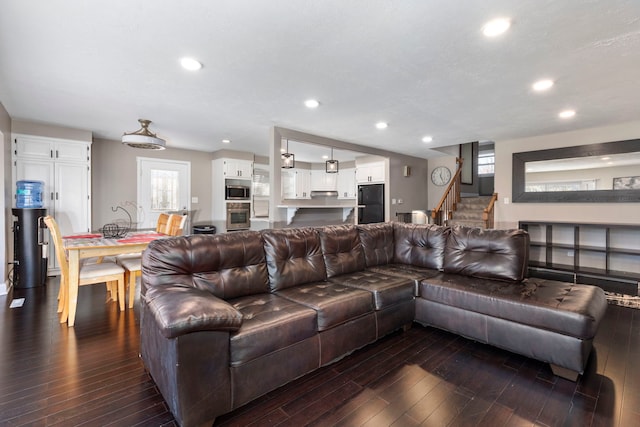 living room featuring dark hardwood / wood-style flooring