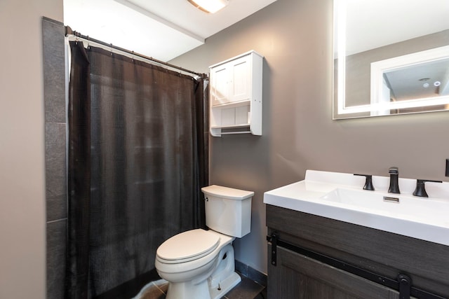 bathroom with vanity, toilet, and walk in shower