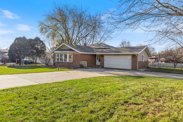 ranch-style home featuring a garage and a front lawn