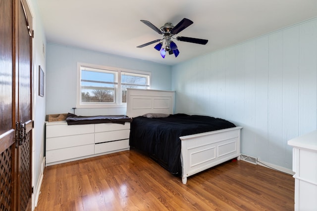 bedroom featuring dark wood-type flooring and ceiling fan