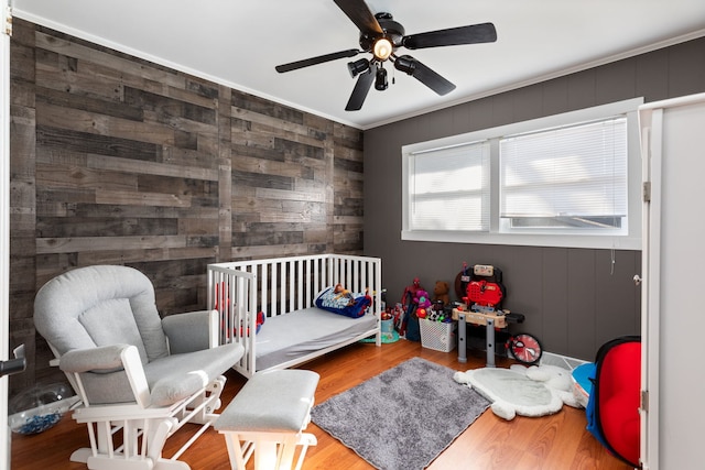 bedroom featuring wood-type flooring and ceiling fan