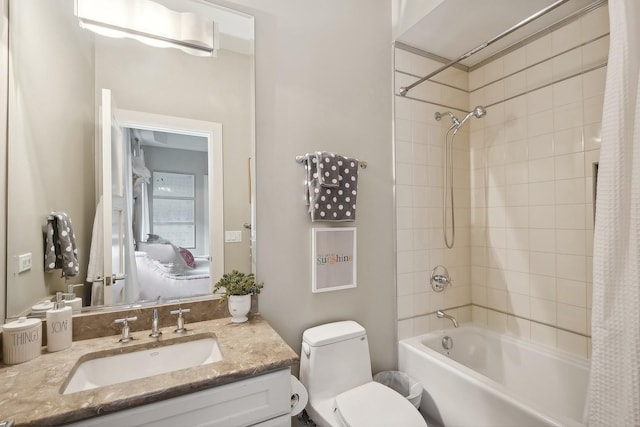 full bathroom with vanity, toilet, and shower / bath combo with shower curtain