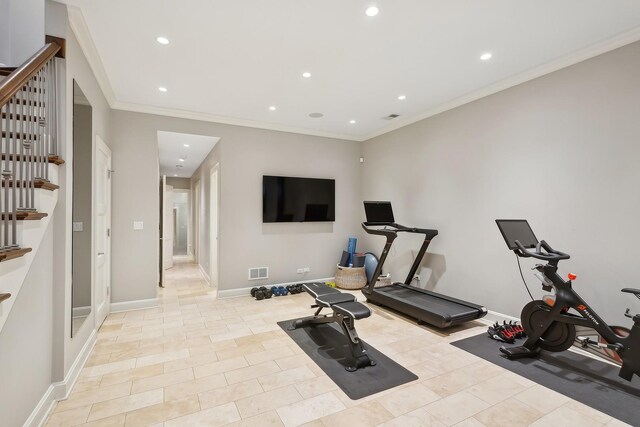 workout area featuring light tile patterned floors and ornamental molding