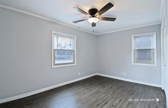 empty room with ceiling fan, dark hardwood / wood-style flooring, and ornamental molding