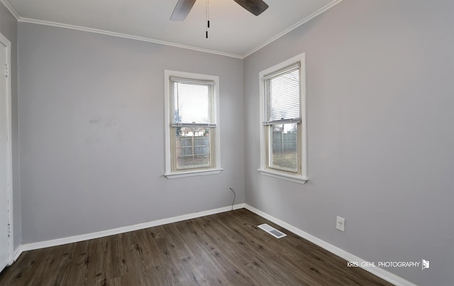 spare room featuring ceiling fan, dark hardwood / wood-style flooring, and ornamental molding