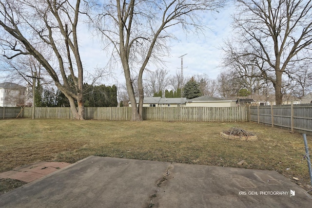 view of yard with a patio and a fire pit