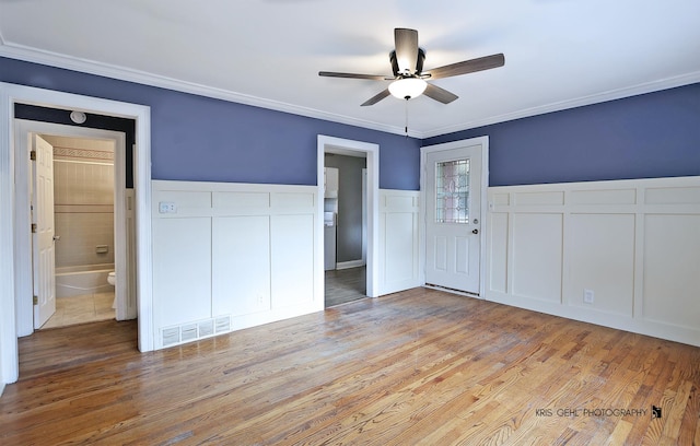 unfurnished bedroom featuring connected bathroom, ceiling fan, and light hardwood / wood-style flooring