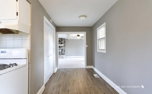 hall with light hardwood / wood-style floors