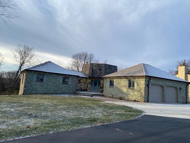 ranch-style house featuring a garage