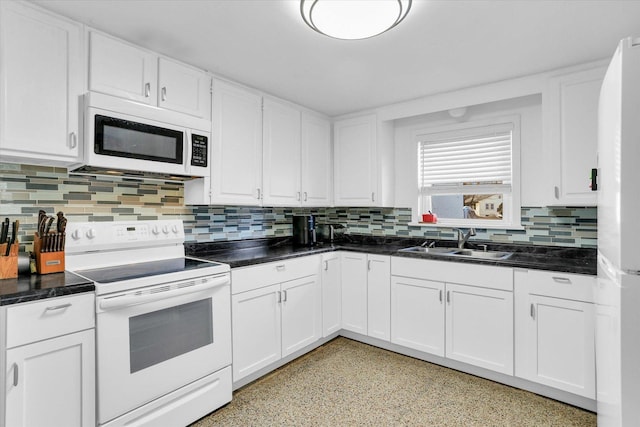 kitchen with white cabinets, backsplash, white appliances, and sink