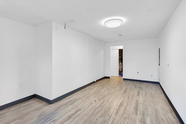 empty room with light wood-type flooring