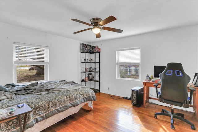 bedroom featuring ceiling fan and hardwood / wood-style flooring