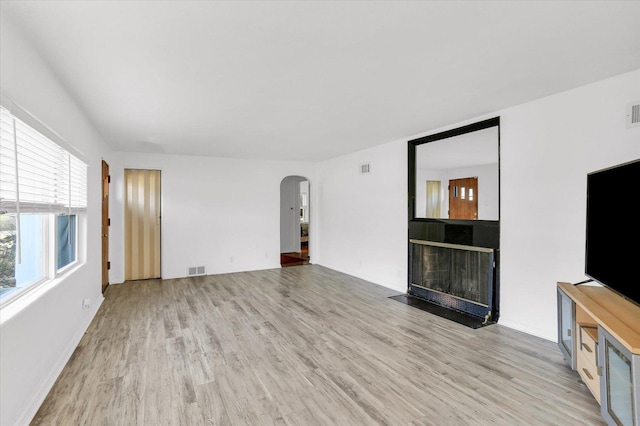 unfurnished living room featuring light hardwood / wood-style flooring