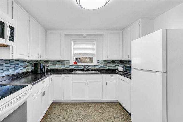 kitchen featuring decorative backsplash, white cabinetry, white appliances, and sink