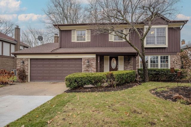 front of property with a garage and a front yard