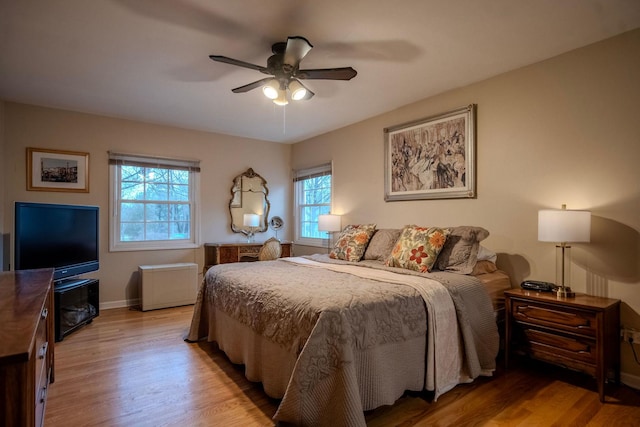 bedroom featuring ceiling fan and hardwood / wood-style floors